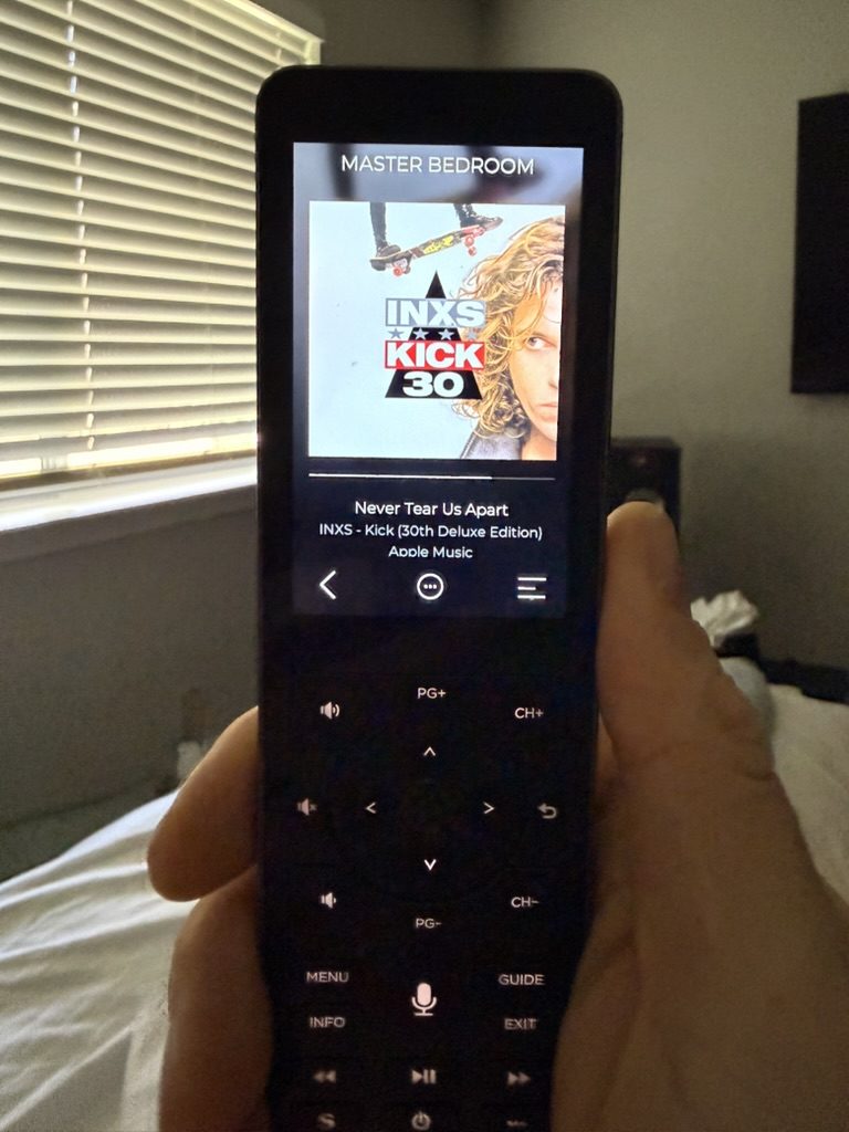 Handheld remote controlling whole-home audio by room
